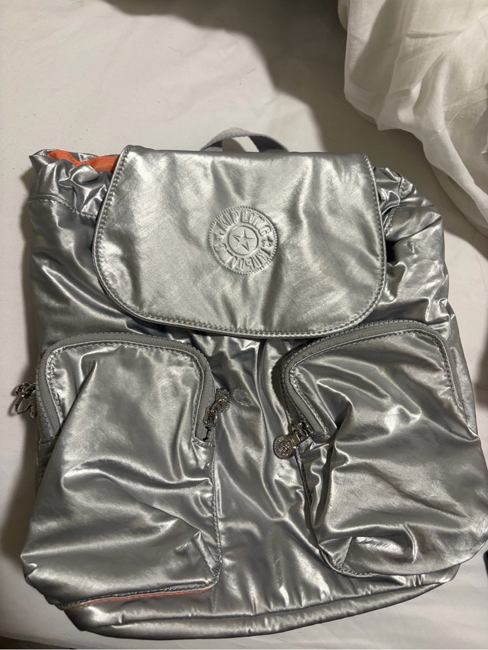Kipling Silver Metallic Backpack with Orange lining Accent